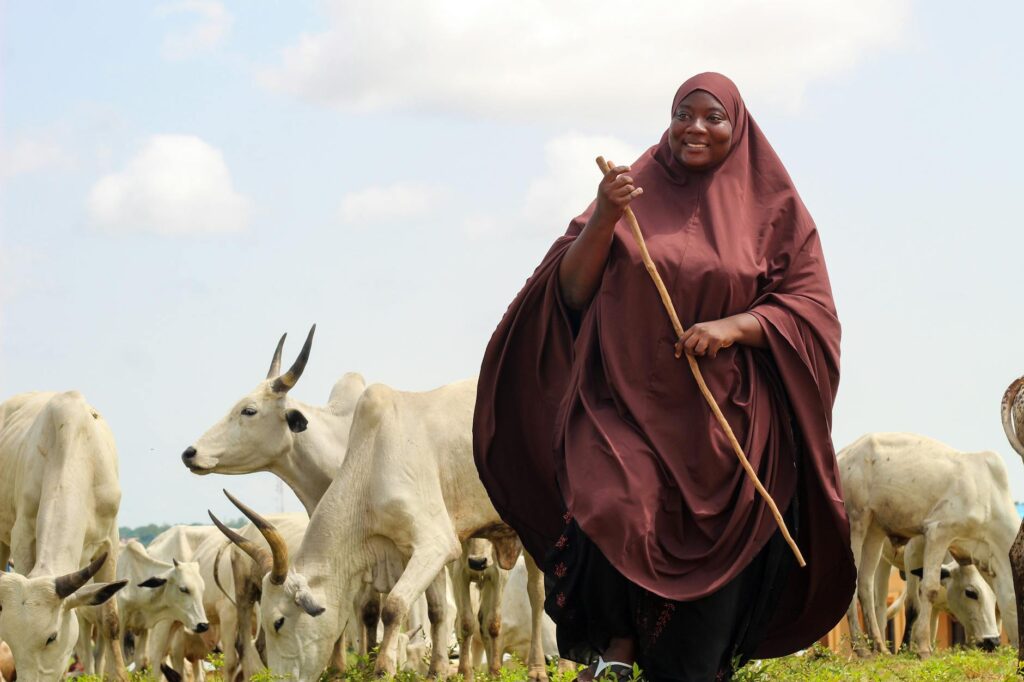 woman in traditional outfit on a pasture